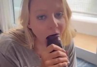 The girl diligently sucks big black cock