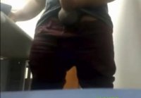 Brazilian Daddy Strokes His Big Uncut Cock at Work