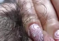 Busty with hairy pussy caresses large clitoris with her finger