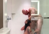 Busty bitch fucks in the shower stall