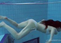 Skinny euro nymphet Roksolana swims naked in the pool