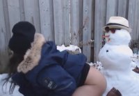 Cutie frolics with snowman