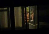 Through the window I filmed how a girl masturbates at home