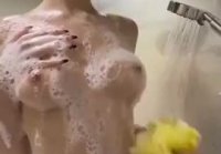 Young girl washes in the shower and shoots video for a guy