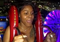 Gravity almost fell out the tits of a black woman on an attraction