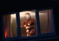 Naked woman in the window