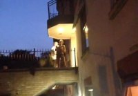 Naked chick shakes her tits on the balcony