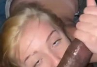 Cute blonde licks heavy black balls