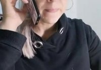 Talking to her husband on the phone