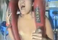 Asian girl took off her bra on the attraction