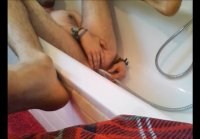 Bi guy using shower head, squirting water, enema